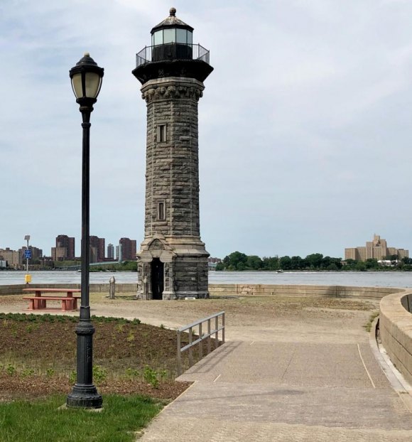 RIOC Racing To The Finish Line For FIGMENT NYC In Lighthouse Park Roosevelt Island's historic lighthouse, finally unobstructed by protective fencing again, stands guard for passing vessels in Hell Gate.